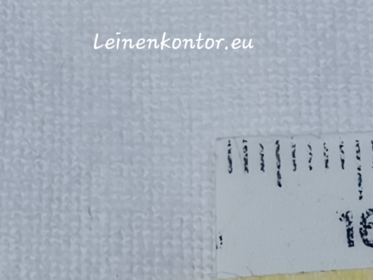 Lleineballen Helles Leinen Textur mit Millimeterskala